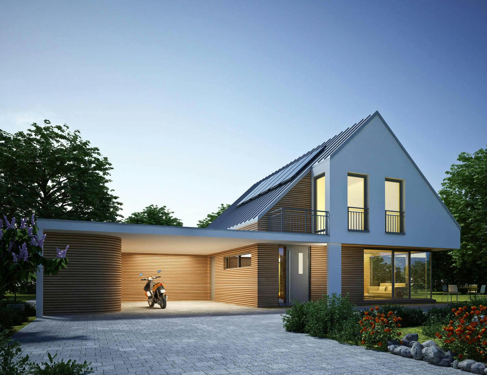 Modern villa i solnedgång med solceller på hustaket i Lund